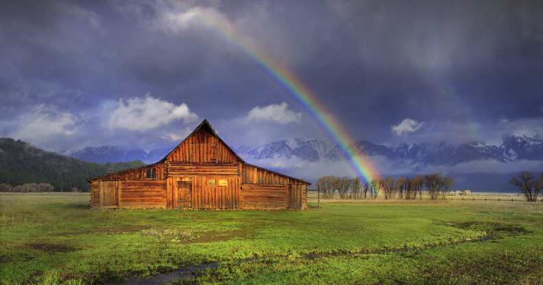 A rainbow over a barn in Wyoming