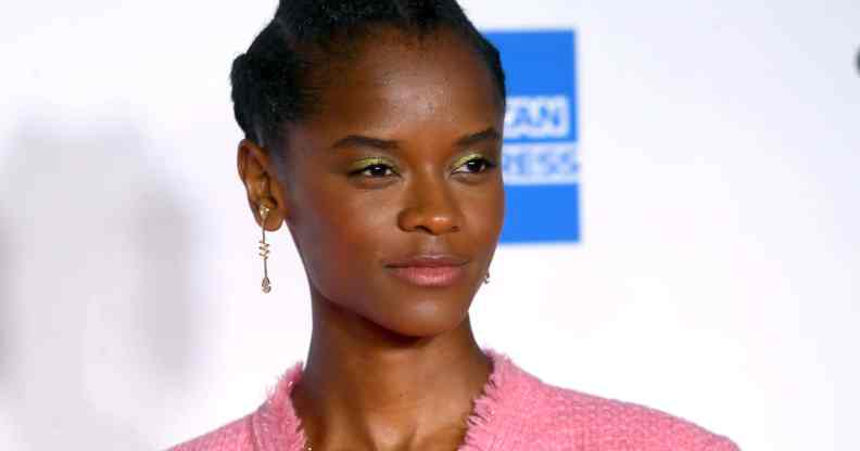 Letitia Wright in a pink suit jacket