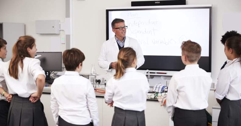 Teacher addressing students in a high school