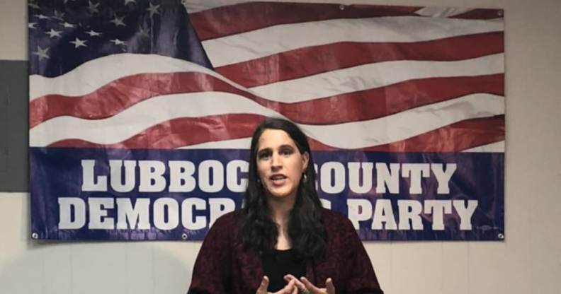 Addison Perry-Franks speaks behind an American flag