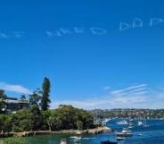 message in aky above sydney Australia that says "kids need dads"