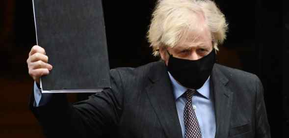 British prime minister Boris Johnson leaves Downing Street on his way to the House of Commons to deliver a statement on the governments four-step plans to release England from the current lockdown