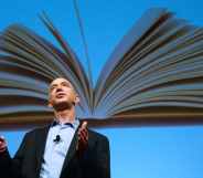 Amazon founder Jeffrey Bezos speaks in front of an image of an opened book