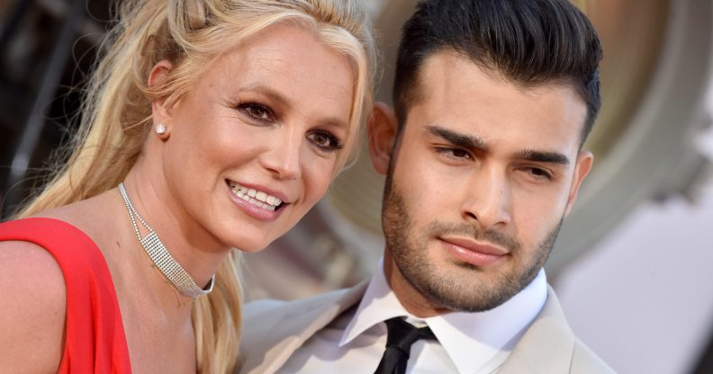 Close crop of Britney Spears and her boyfriend Sam Asghari smiling on the red carpet