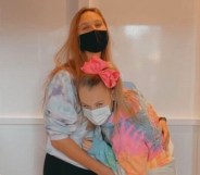 JoJo Siwa hugs her girlfriend