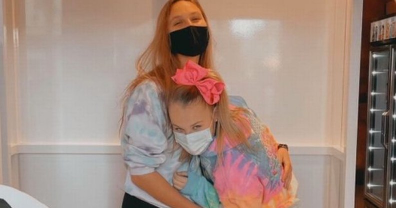 JoJo Siwa hugs her girlfriend