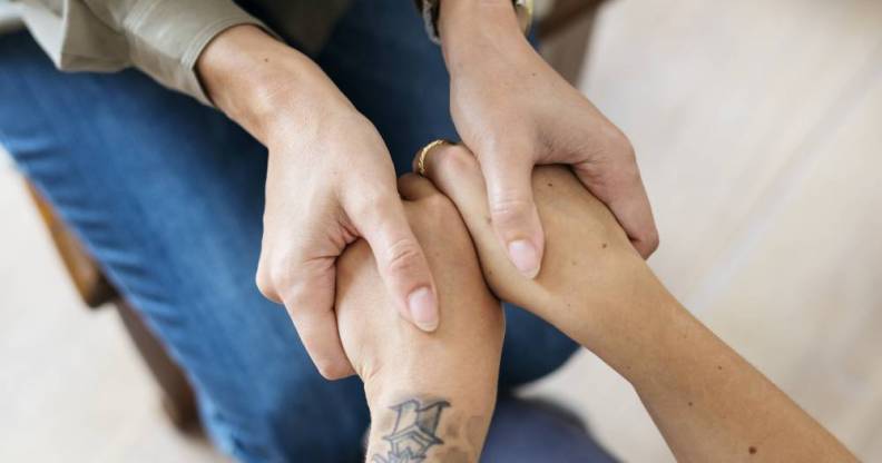 Women holding hands