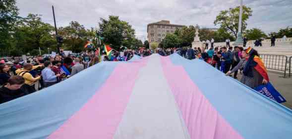 A giant trans flag unfurled outside the US Supreme Cour