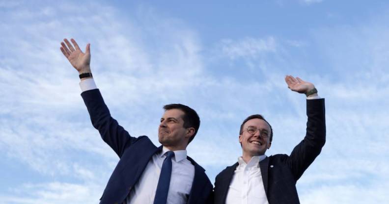 Pete and Chasten Buttigieg waving