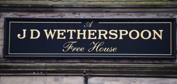 A close up of a Wetherspoons pub sign