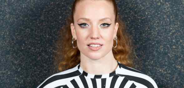 Jess Glynne wearing a black and white dress