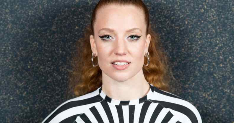 Jess Glynne wearing a black and white dress