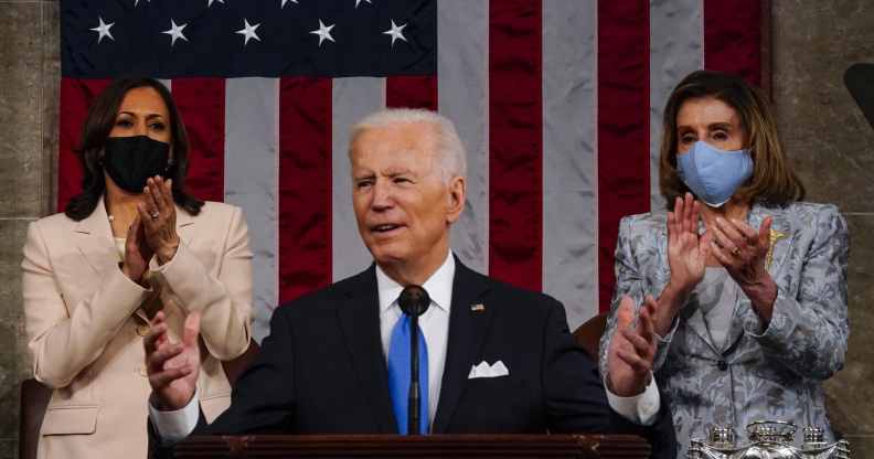 President Joe Biden addresses a joint session of Congress, with vice president Kamala Harris (L) and House speaker Nancy Pelosi (R) on the dais