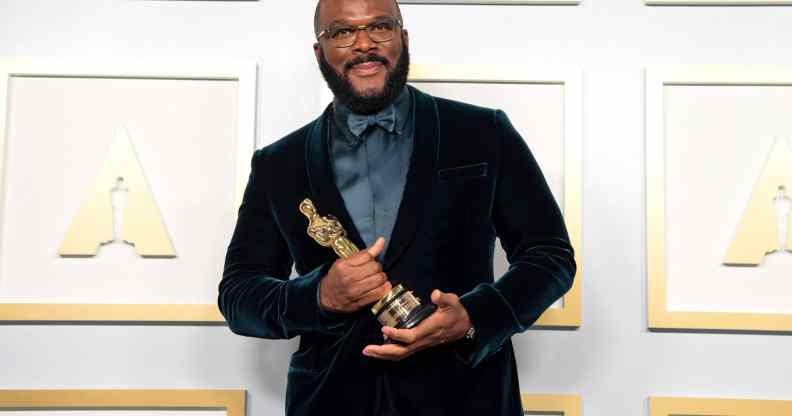 Tyler Perry, winner of the Jean Hersholt Humanitarian Award, poses in the press room