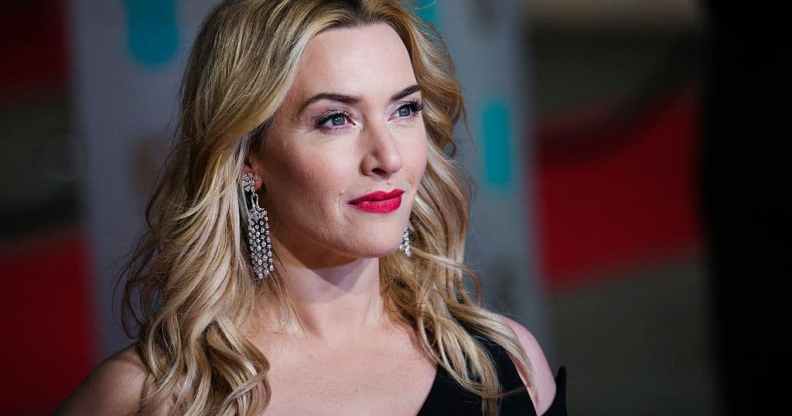 Actor Kate Winslet is dressed in a black evening dress as she attends a press event