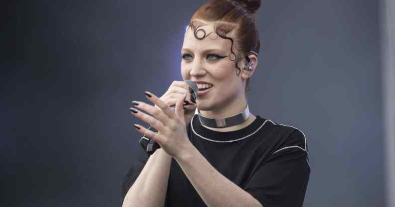 Jess Glynne sings into the microphone