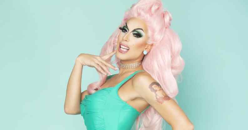 Alaska, a drag queen in pink hair and a green dress