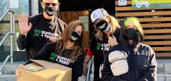 Billie Eilish and her parents, Patrick O’Connell and Maggie Baird, wearing Support + Feed tees