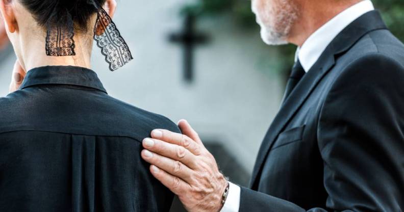 funeral image two people in mourning