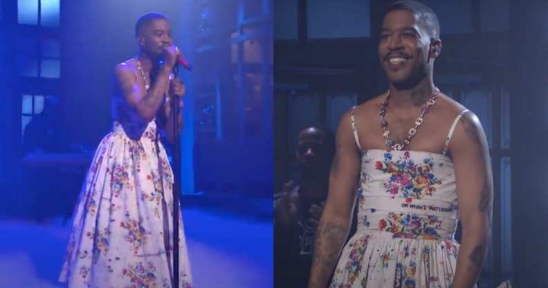 Kid Cudi performs on-stage in a white floral dress