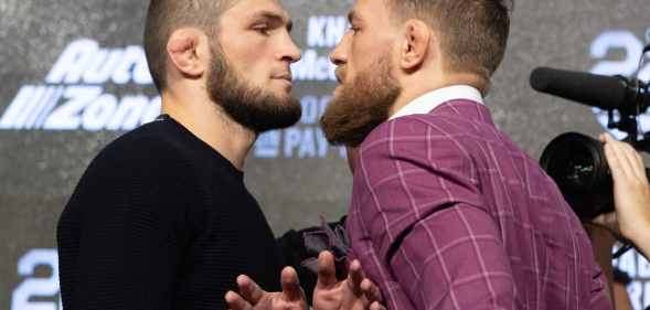 Retired UFC lightweight champion Khabib Nurmagomedov (L) and Conor McGregor (R) face off after the UFC 229 press conference