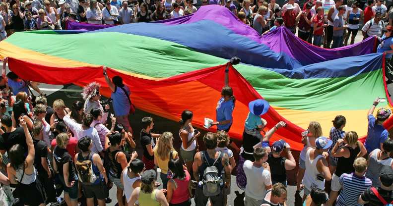 The Rainbow flag, a symbol of gay pride is paraded down Fitzroy Street