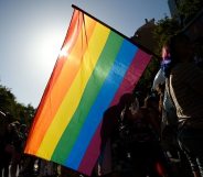 Participants wave a rainbow flag during the 2019 Gay Pride parade in Barcelona