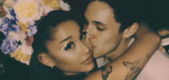 Ariana Grande receives a kiss on the cheek from Dalton Gomez