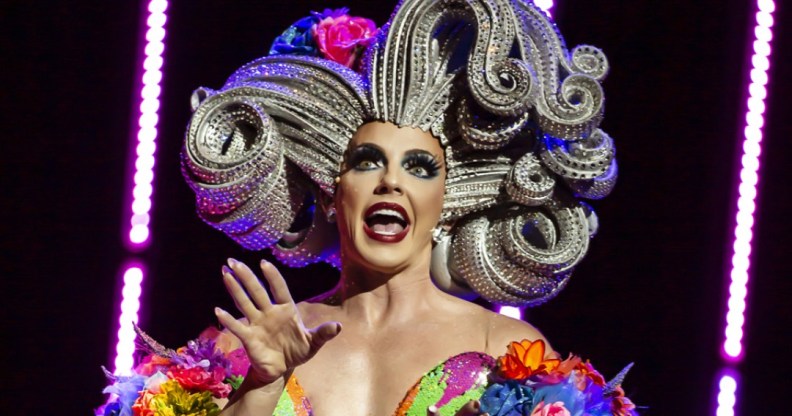 Alyssa Edwards in a huge, sculpted silver wig and rainbow-coloured dress