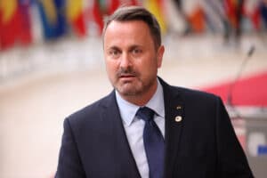 Prime minister of Luxembourg Xavier Bettel speaks to press members as he arrives for the first day of European Union (EU) Summit