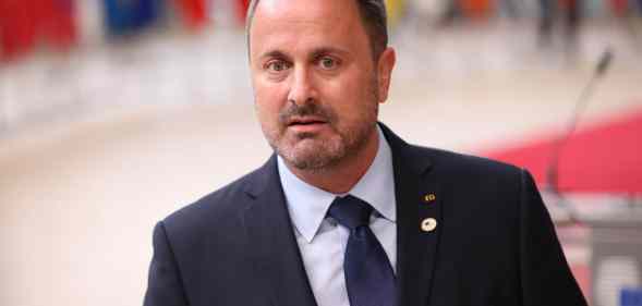 Prime minister of Luxembourg Xavier Bettel speaks to press members as he arrives for the first day of European Union (EU) Summit