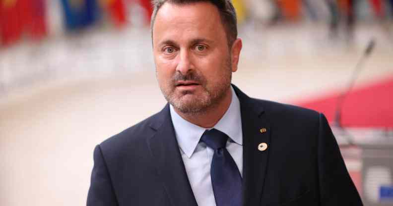 Prime minister of Luxembourg Xavier Bettel speaks to press members as he arrives for the first day of European Union (EU) Summit