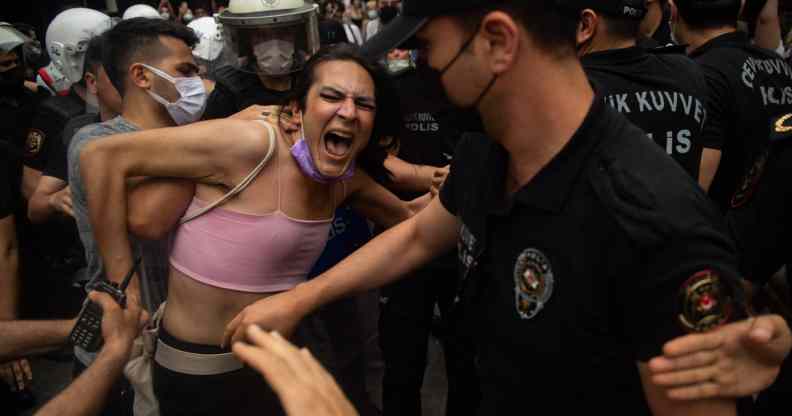 A protester is detained by police the Pride march in Istanbul on 26 June, 2021