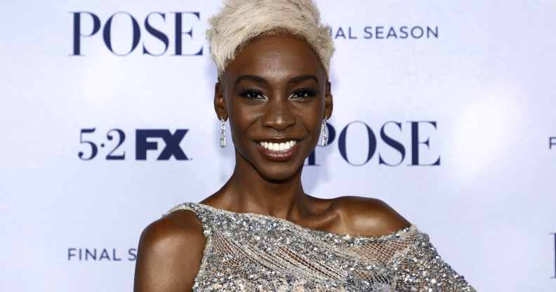 Angelica Ross with short blonde hair, smiling