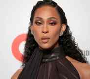 Mj Rodriguez in a halter-neck dress, her hair slicked back