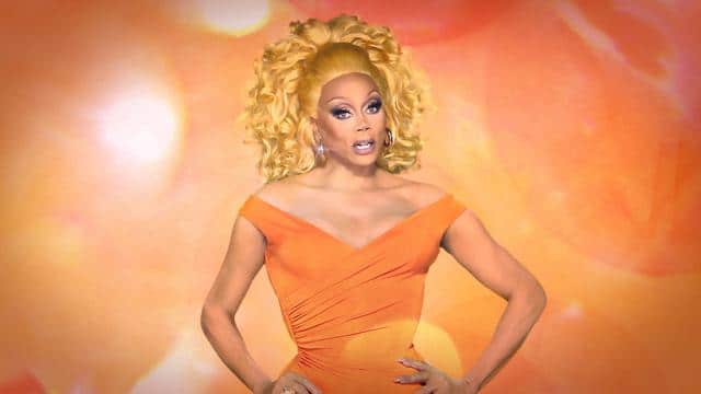 RuPaul in an orange dress