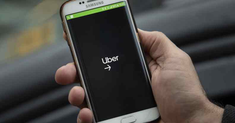 A phone displaying the Uber logo