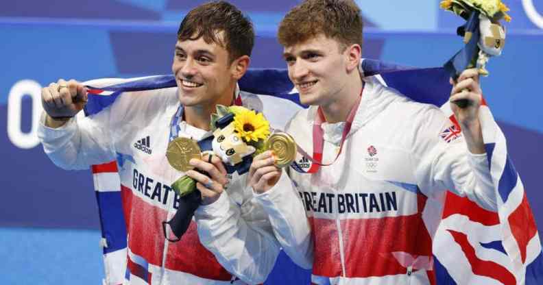 Tom Daley Matthew Lee pose with their gold medals at the Tokyo 2020 Olympic games