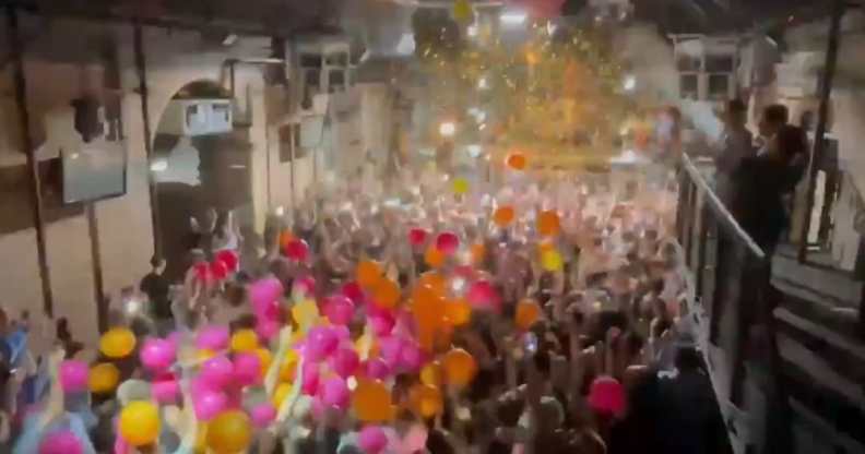 The dancefloor of Heaven with balloons falling onto revellers