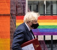 Boris Johnson walks beneath the Pride Month installation outside number 10