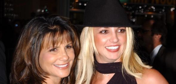 Lynne Spears (L) and Britney Spears pose for the camera wearing black