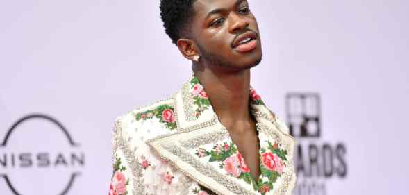 Lil Nas X in a floral suit with a super-wide lapel