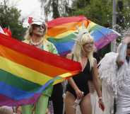 Pride-goers waving rainbow flags in Kyiv