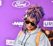 Da Brat looks at the camera under her sunglasses