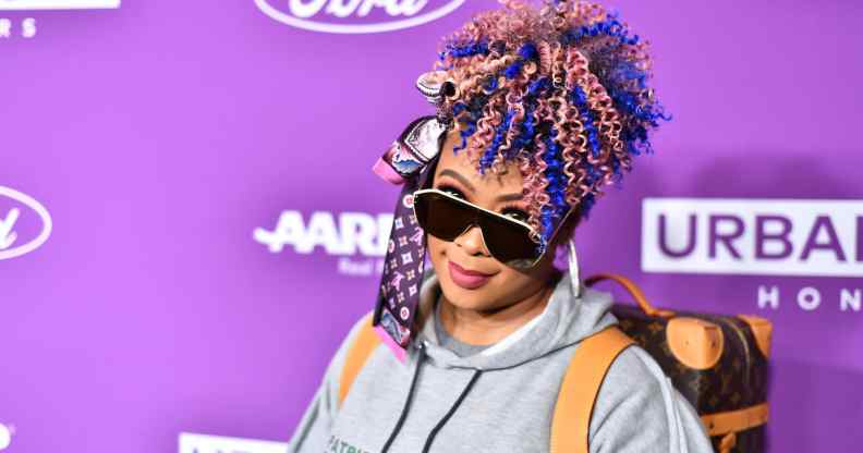 Da Brat looks at the camera under her sunglasses