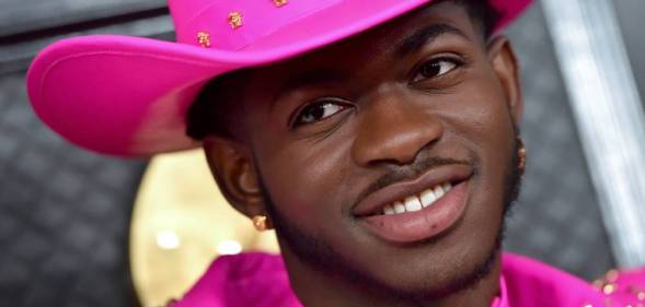 Lil Nas X wearing a hot pink outfit as he attends the 62nd Annual GRAMMY Awards