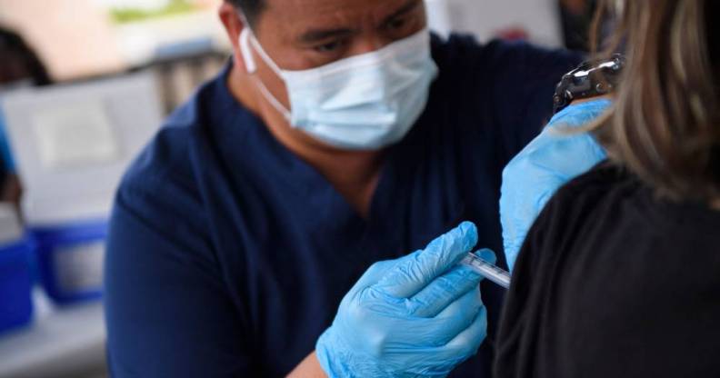 A nurse administers a dose of Covid-19 vaccine