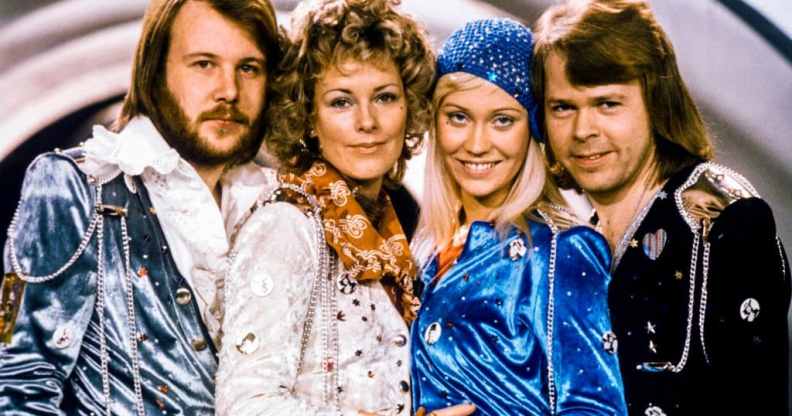 The four original members of ABBA posing for a photo together after winning the Eurovision Song Contest