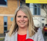 Hannah Blythyn poses with a red rosette