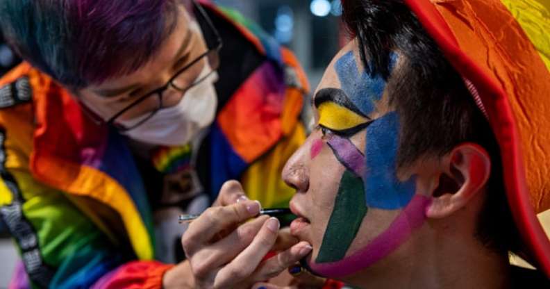 Pro-democracy activist Jimmy Sham Tsz-Kit getting his face painted in rainbow colours during 2020 Hong Kong Pride